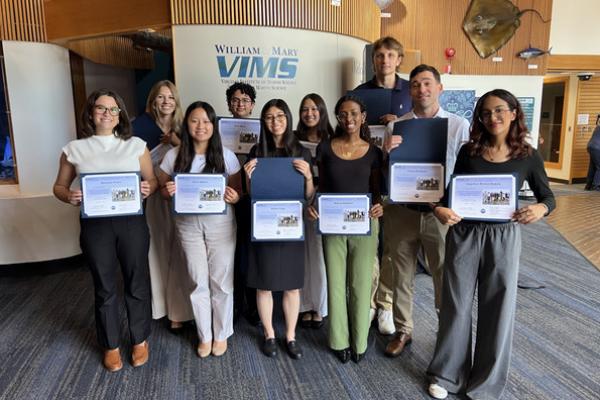 A group of students displaying certificates.