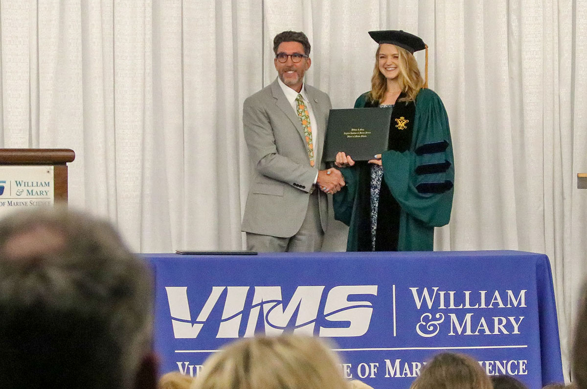 Alex Schneider celebrates graduation at the W&M School of Marine Science Diploma Ceremony. Photo by John Wallace.